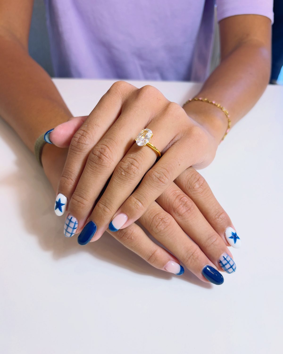 Hand-painted navy stars and gingham on a soft pink base.